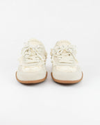 Sneaker con fiocco in perle