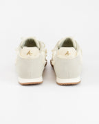 Sneaker con fiocco in perle