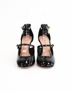 Décolleté in vernice con cinturino