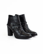 Tronchetto in pelle con dettagli cinturino