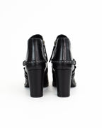 Tronchetto in pelle con dettagli cinturino