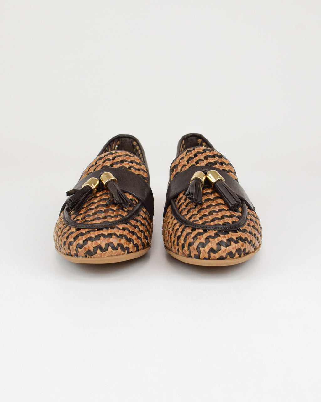 Mocassino in pelle intrecciata con nappine