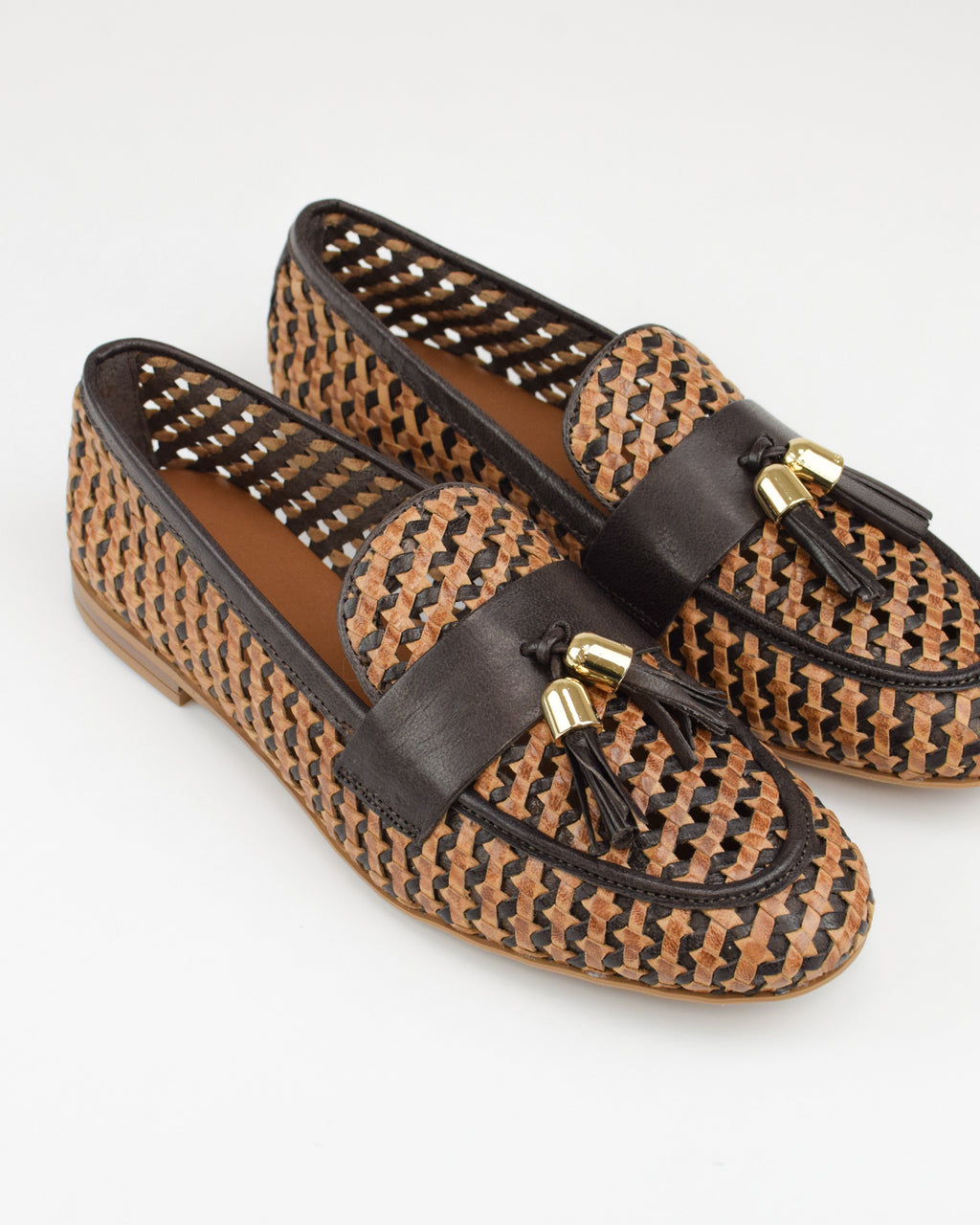 Mocassino in pelle intrecciata con nappine