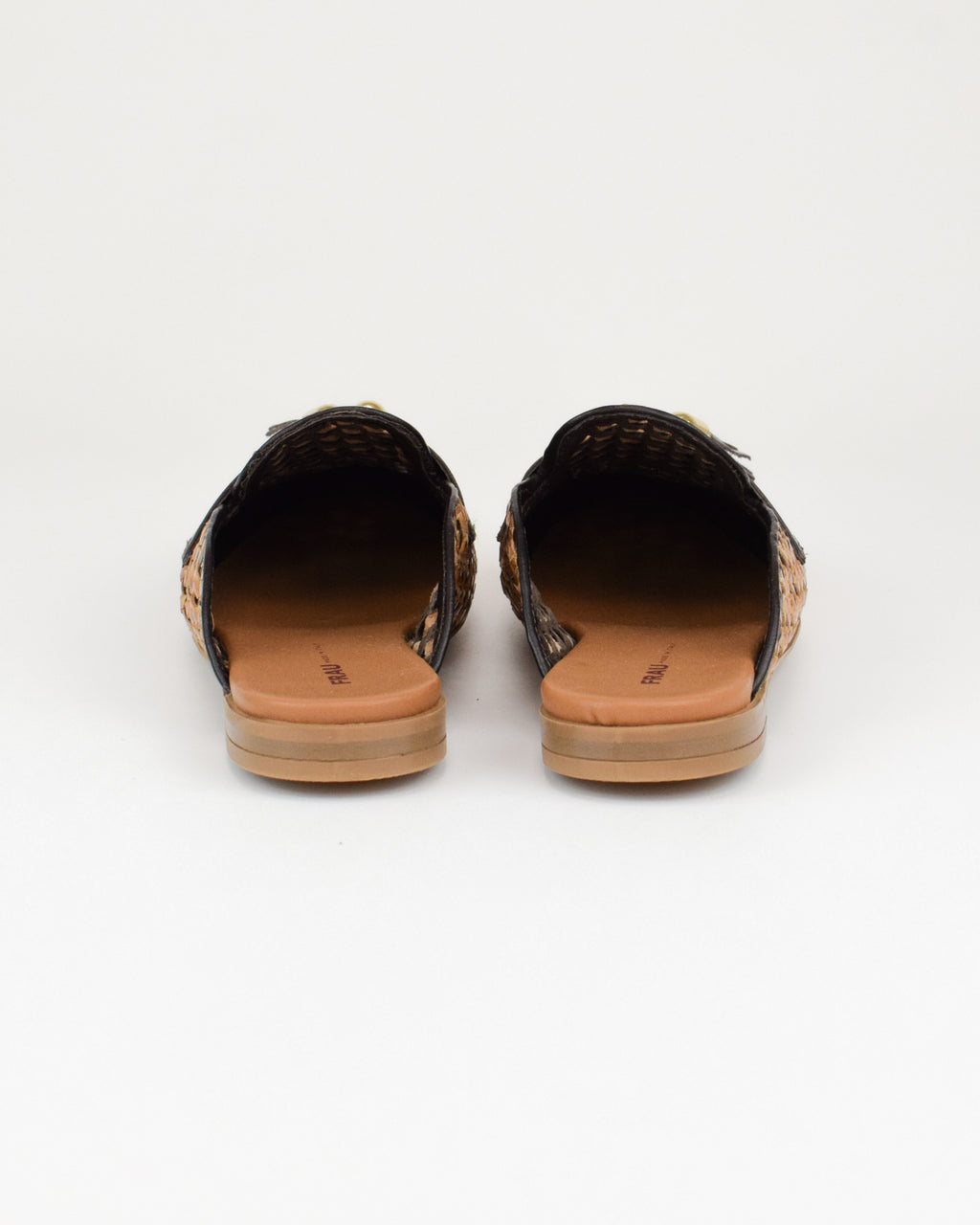 Sabot in pelle intrecciata con nappine