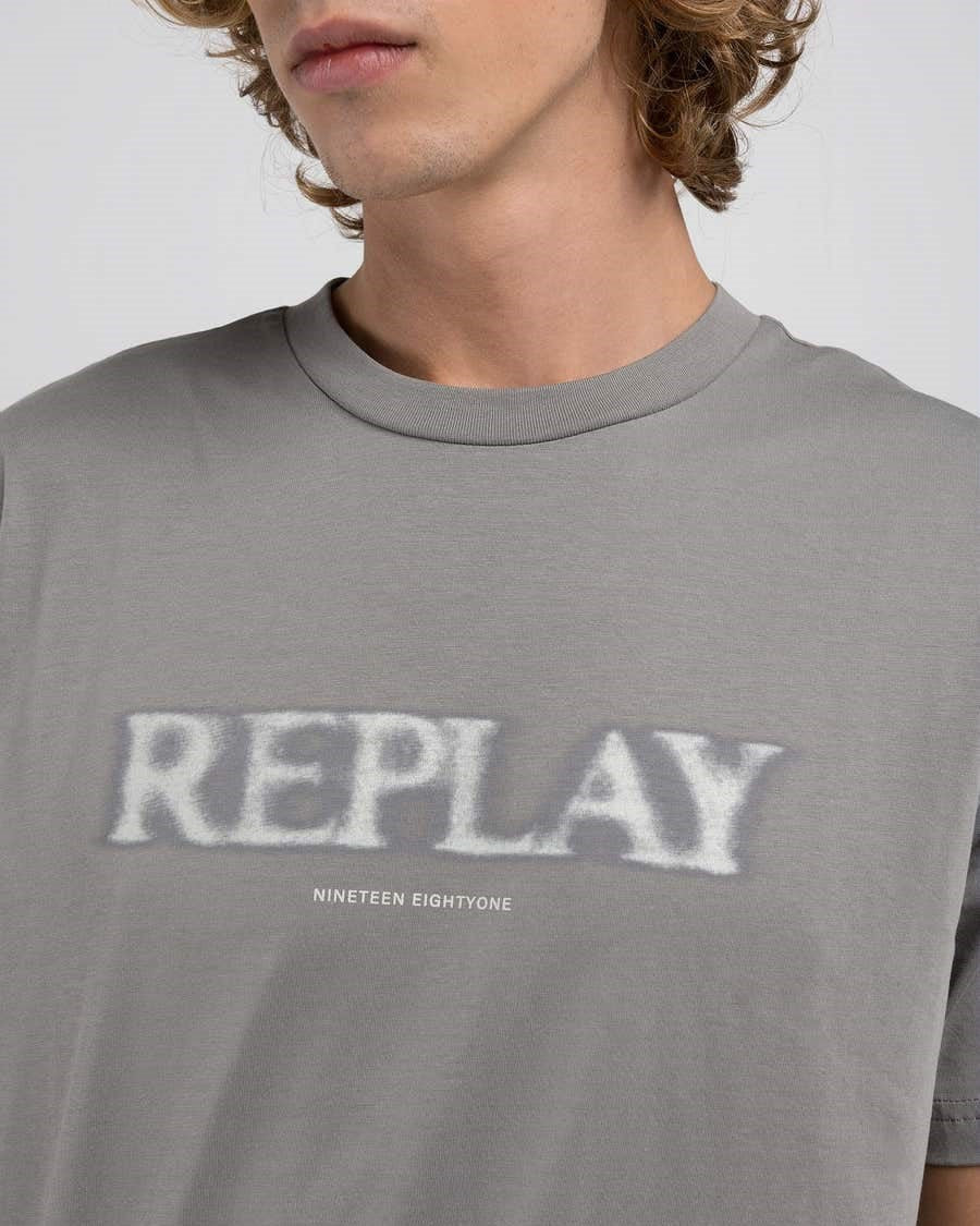T-Shirt con lettering sfocato