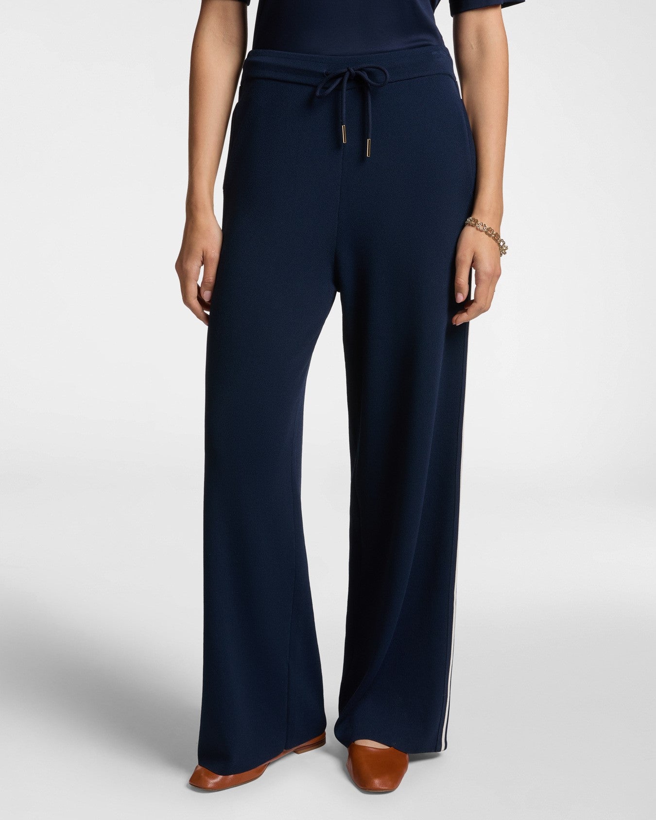 Pantaloni in maglia con bordi a righe