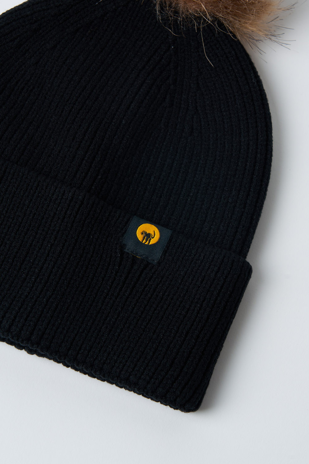 Cappellino in maglia con pompon Vega
