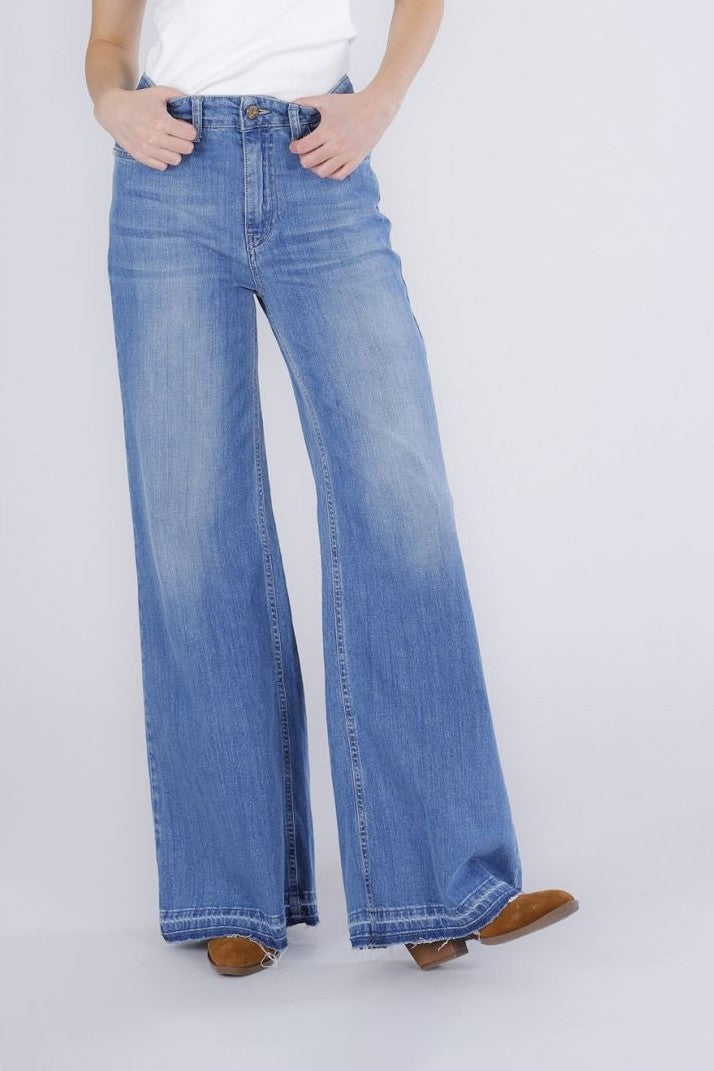 Pantalone palazzo con orlo sciolto