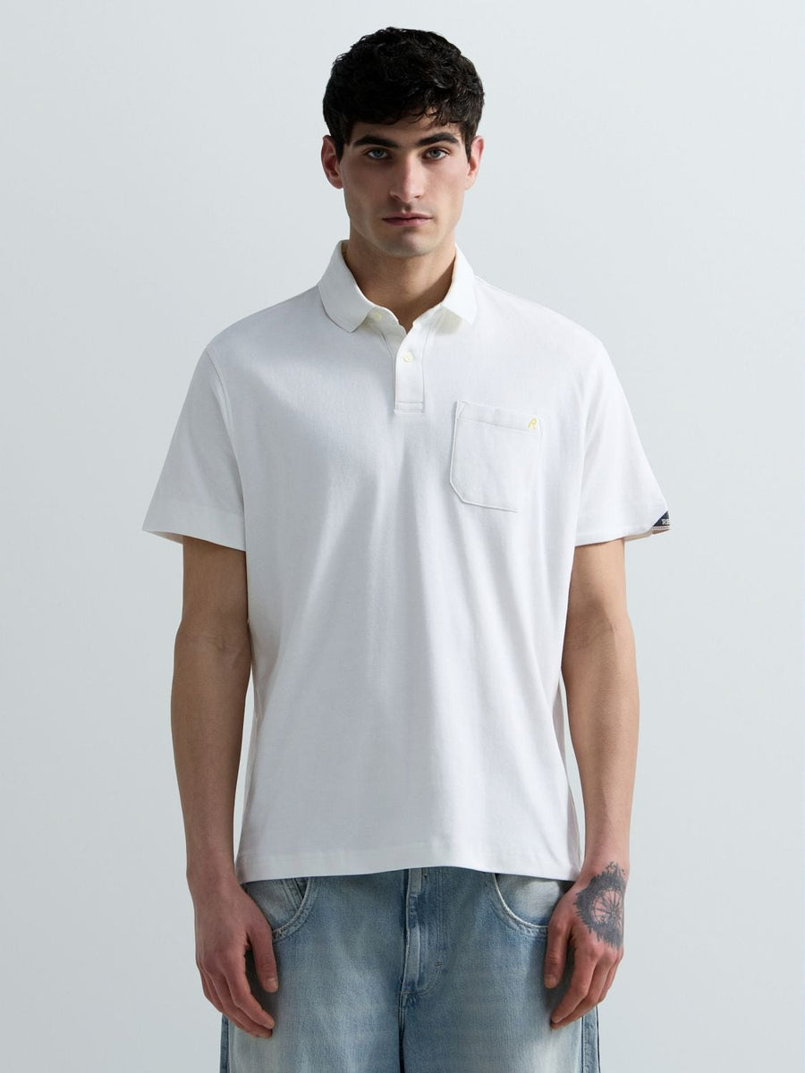 Polo in jersey con taschino e ricamo R